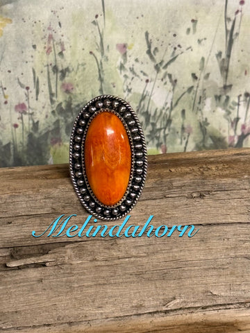 R97, orange spiny ring
