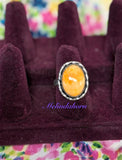 Size 7 is aw orange spiny ring