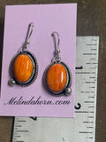 Orange spiny dangle earrings