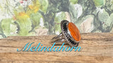 R107, orange spiny round ring