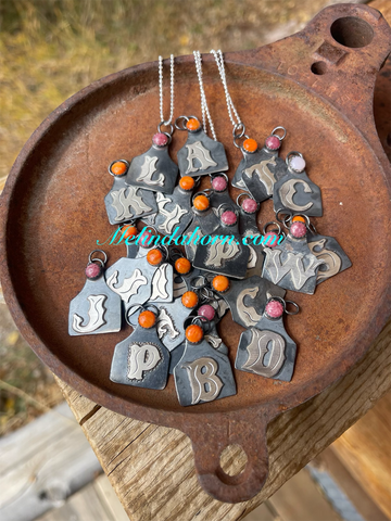 Cowtag necklace w/ orange spiny oyster in