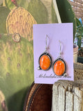 Orange spiny dangle earrings