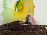 R65, pink conch ring size 9 1/2